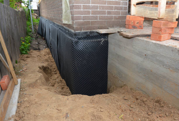 SJ Waterproofing Pros technician performing targeted Exterior Waterproofing assessment in New Holland, OH